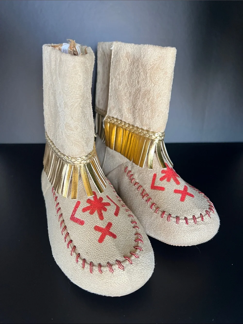 Disney Beige Moccasin Boots with Gold Fringe and Red Embroidery